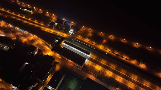 istock Aerial view of illuminated highway at night 1444377453