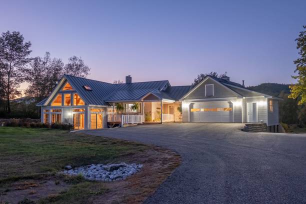istock Modern cozy lit house against a cloudy sky in the evening 1444379806