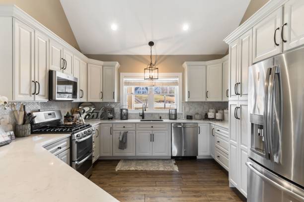 istock Luxury kitchen with white cabinetry and chrome appliances 1444379992