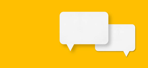 istock speech balloon shape white paper isolated on yellow background 1444381216