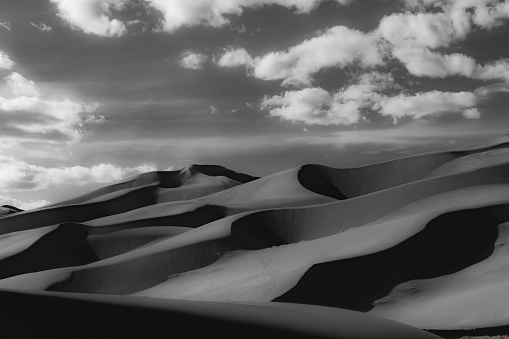 Grayscale Of The Sand Dunes In Colorado Against A Cloudy Sky Background ...
