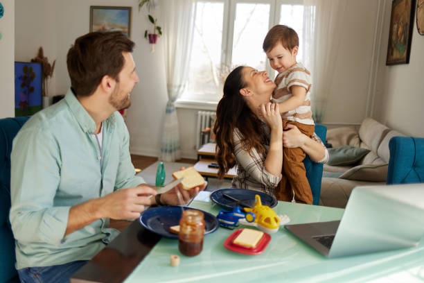 istock Playful parents spending some quality time with their adorable son at breakfast time 1444387862