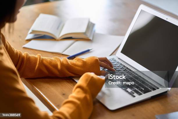 Asian Womans Hand Studying For Qualifications Stock Photo - Download Image Now - Laptop, E-Learning, People