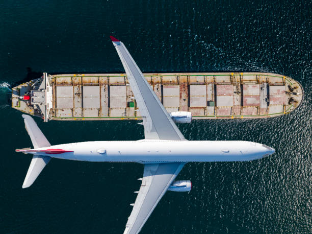 istock Container ship sail through airplane flying on the sea 1444391322