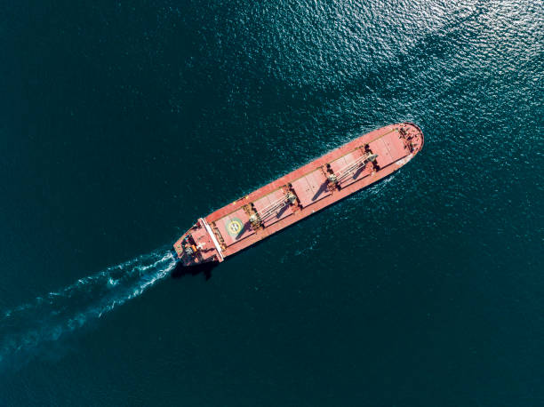 istock Cargo ship in import export and business logistic, Logistic and transportation of International Container Cargo ship in the open sea, Aerial shot from drone. 1444391344