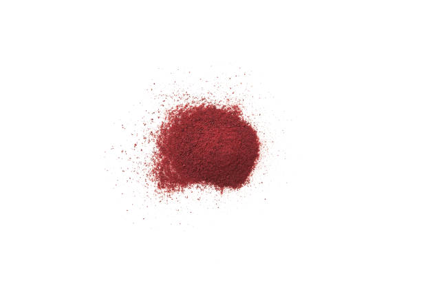 istock Dry beet powder scattered on white surface. Food additive E162. Heap Beetroot powder. Pigment beet red used in culinary 1444391741