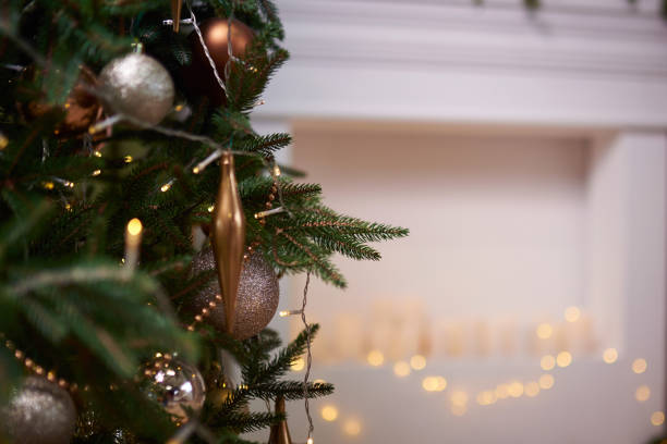 istock Decorated christmas tree, ornaments against a Defocused Lights Background 1444393279