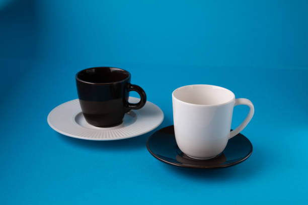 istock photo white cup and brown cup 1444396013