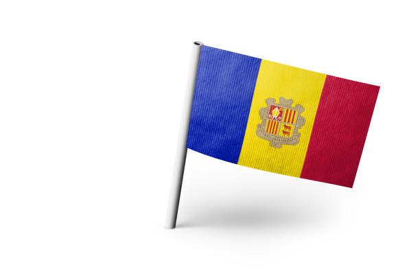Small paper flag of Andorra pinned. Isolated on white background. Horizontal orientation. Close up photography. Copy space.
