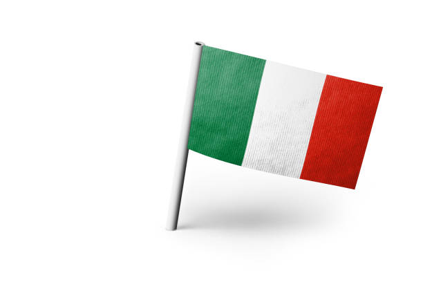 Small paper flag of Italy pinned. Isolated on white background. Horizontal orientation. Close up photography. Copy space.