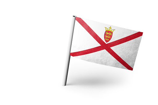Small paper flag of Jersey pinned. Isolated on white background. Horizontal orientation. Close up photography. Copy space.