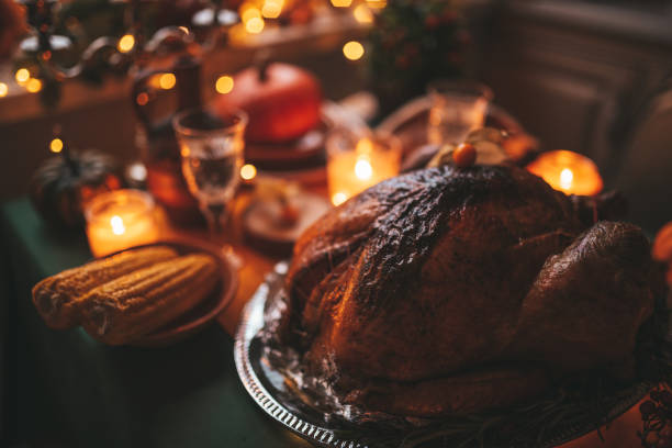 istock Thanksgiving holiday dinner table setting with fall decoration and pumpkins 1444397148