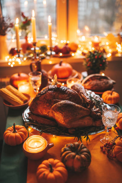 istock Thanksgiving holiday dinner table setting with fall decoration and pumpkins 1444397213