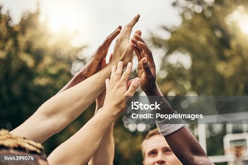 istock Basketball, winner and hands, team high five for outdoor game. Success, diversity and victory goal for sports for men. Teamwork, diversity and support, friends on basketball court together with coach 1444399074