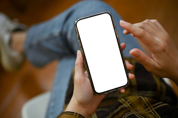 istock Top view, A female using her smartphone while relaxes sitting in her room. 1444400079