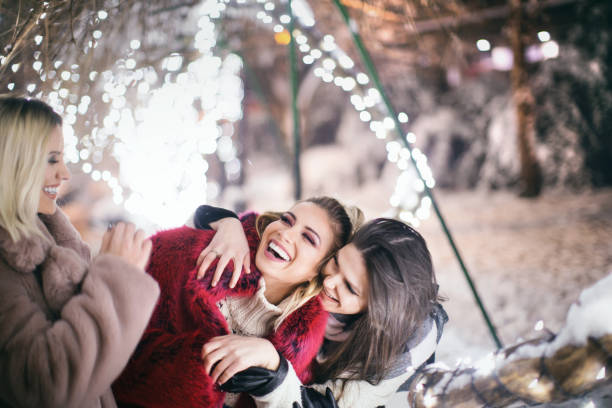 istock Friends having fun during beautiful winter night. 1444401493