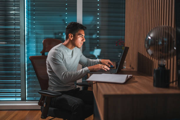 istock Handsome Latino Man Working At  Home 1444402478