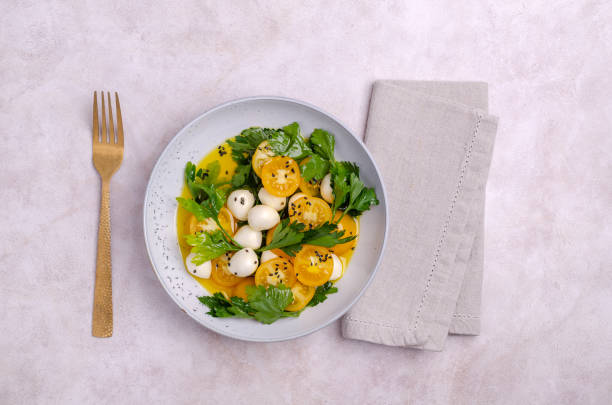 istock Yellow tomatoes, mozzarella and parsley 1444403210
