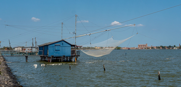Fishing hut with net in Italy