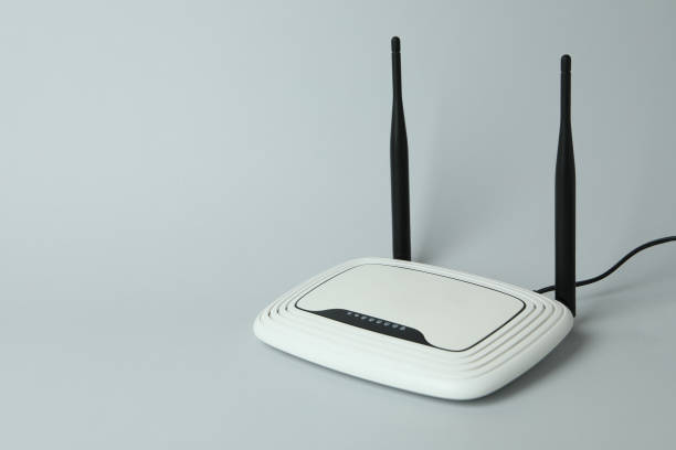 istock Wi-Fi router with external antennas on gray background 1444406185