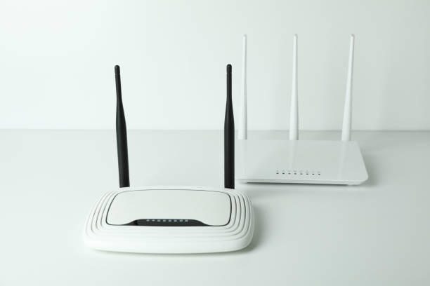 istock Wi-Fi routers with external antennas on white background 1444406236