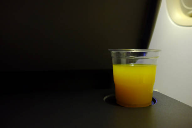 istock Orange Juice in the Plastic Cap Serving on the Flight. 1444406545