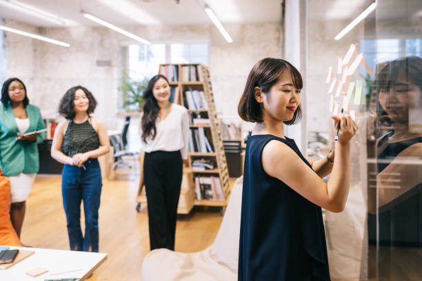 istock Business people creating mind map full of fresh ideas. 1444407535