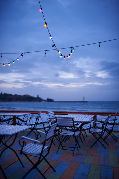 istock Summer empty outdoor cafe on the seashore at sunrise 1444409349