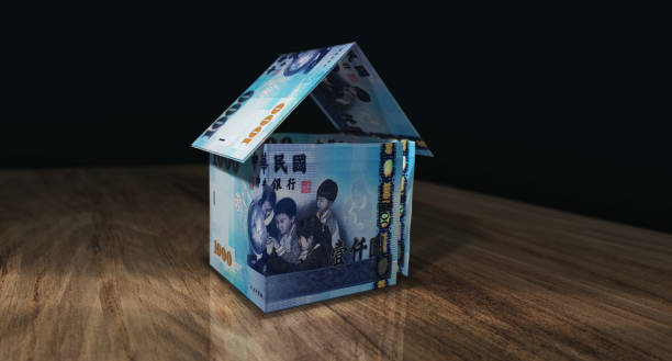 Taiwan Taiwanese Dollar 1000 TWD money banknotes paper house on the table 3d illustration Taiwanese Dollar 1000 TWD money banknotes paper house on the table. Taiwan currency notes 3D illustration concept of home mortgage loan, costs, liabilities and Dollar estate financing. twd stock pictures, royalty-free photos & images