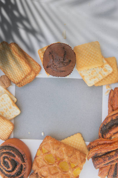 istock Assorted sweet pastries with gray color empty card template, top view 1444415414