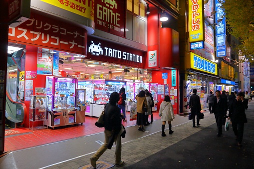 People shop in night Akihabara district of Tokyo. Akihabara district is known as Electric Town district, it has reputation for electronics stores and otaku culture.