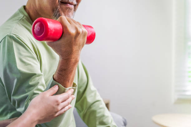 istock Hand holding weight lifting Close up, Senior people doing physical therapy after surgery operation, Elderly adult exercising by lifting weights at home, Medical treatment concept 1444417484