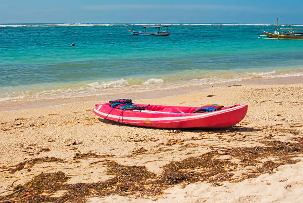 istock boat in tropical sea on blue shade sky background 1444418529