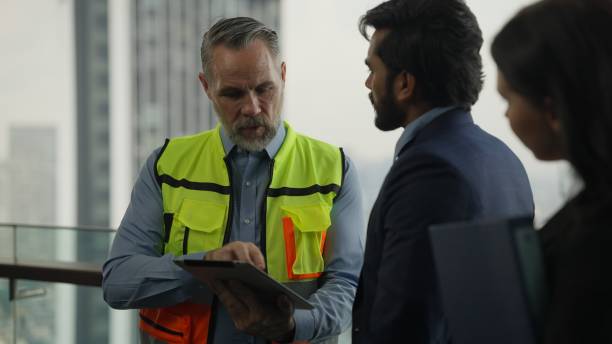 istock Engineer and businessman talking. Project planing between engineer foreman manager and businessman, Construction workers, Contractor 1444419812