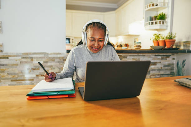 istock Senior woman working with laptop computer from home - Elderly lifestyle and technology concept - Focus on face 1444419992