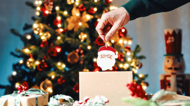 istock Picking Up Christmas Ornaments from the box 1444422702