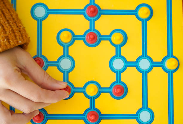 istock unrecognizable player playing a board game in a reflection table. Entertainment and recreational 1444422703