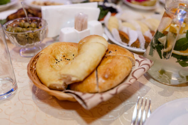 a khachapuri on the table in the restaurant at lunch