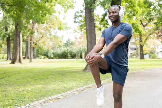 istock Athlete stretching legs and knees before working out 1444426641