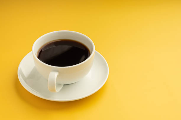 istock Top view of a white coffee cup is on a yellow background 1444429158