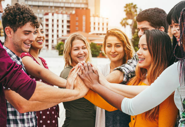 istock Young happy people stacking hands outdoor - Focus on hands 1444430990
