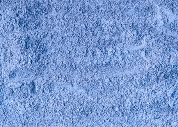 istock Light blue bentonite facial clay powder (alginate modeling mask, eye shadow, body wrap) texture close up, selective focus. Abstract background. 1444431244