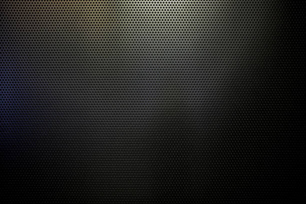 istock Black Punched Metal Sheet Wall Texture Background. 1444431375