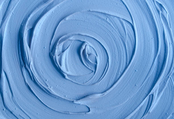 istock Light blue bentonite clay (face cream, alginate facial mask, body wrap, hair conditioner) texture close up, selective focus. Abstract background with circle brush strokes. 1444432150