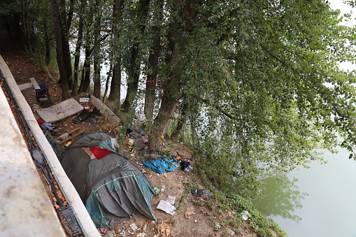 Homeless tent campsite by River Garonne in downtown Toulouse city. Toulouse is the 4th largest commune in France.