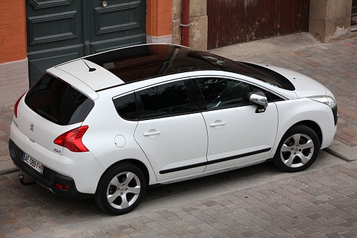 Peugeot 3008 compact crossover car parked in a street in Toulouse. There are 32 million cars registered in France.