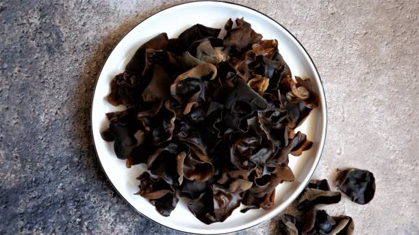 istock Top view  of Muer Mushroom  on white ceramic plate with grey background. Auricularia Polytricha. Edible Mushroom. 1444436891