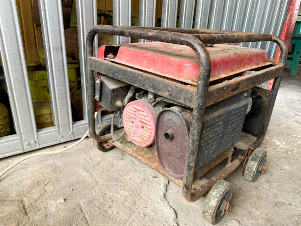 istock Portable power generator rusty in the warehouse. Compact equipment for powering various devices in nature and in places without power supply 1444436980