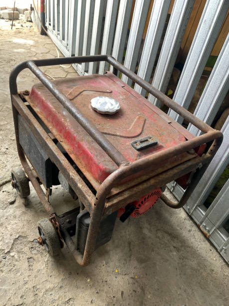 istock Portable power generator rusty in the warehouse. Compact equipment for powering various devices in nature and in places without power supply 1444437105