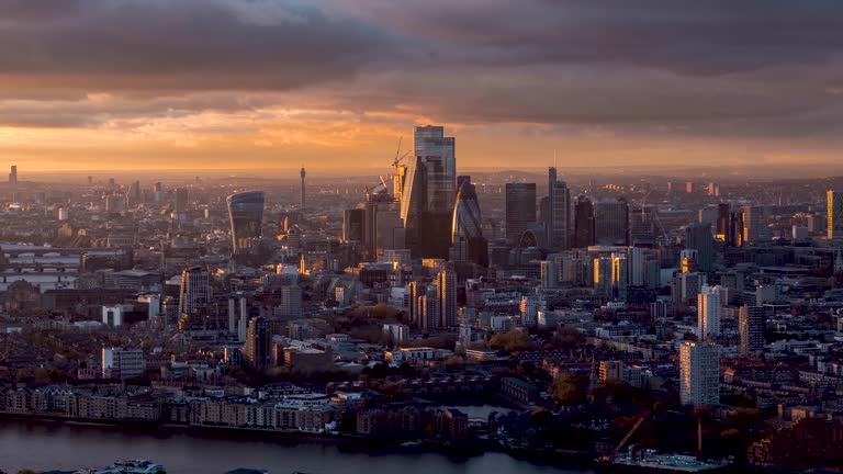 Day to night sunset time lapse of the skyline at the City of London